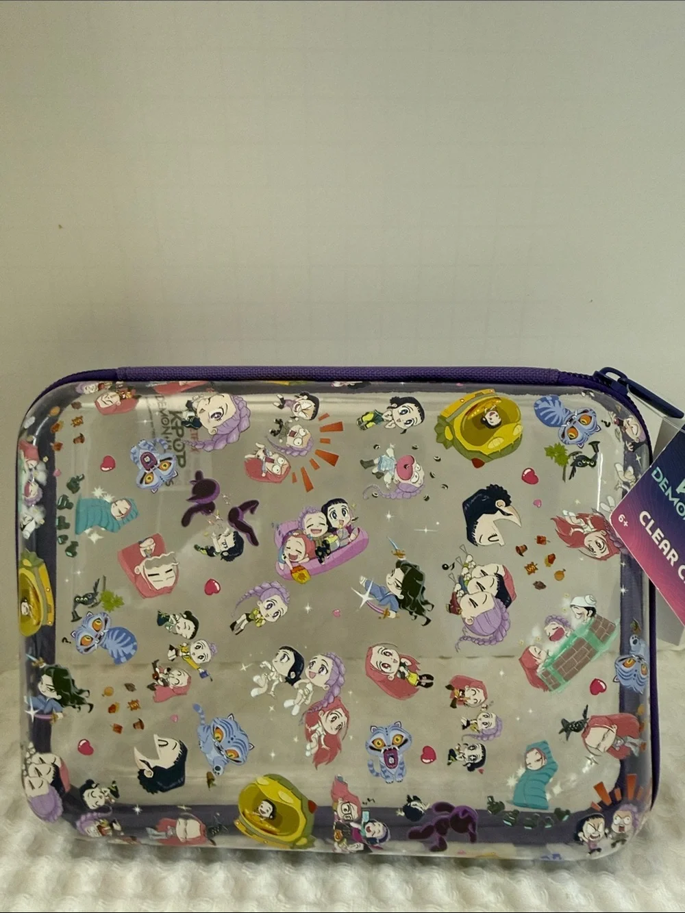 Netflix K-POP Demon Hunters Chibi-Style Clear PVC Pencil Case with Purple Trim.